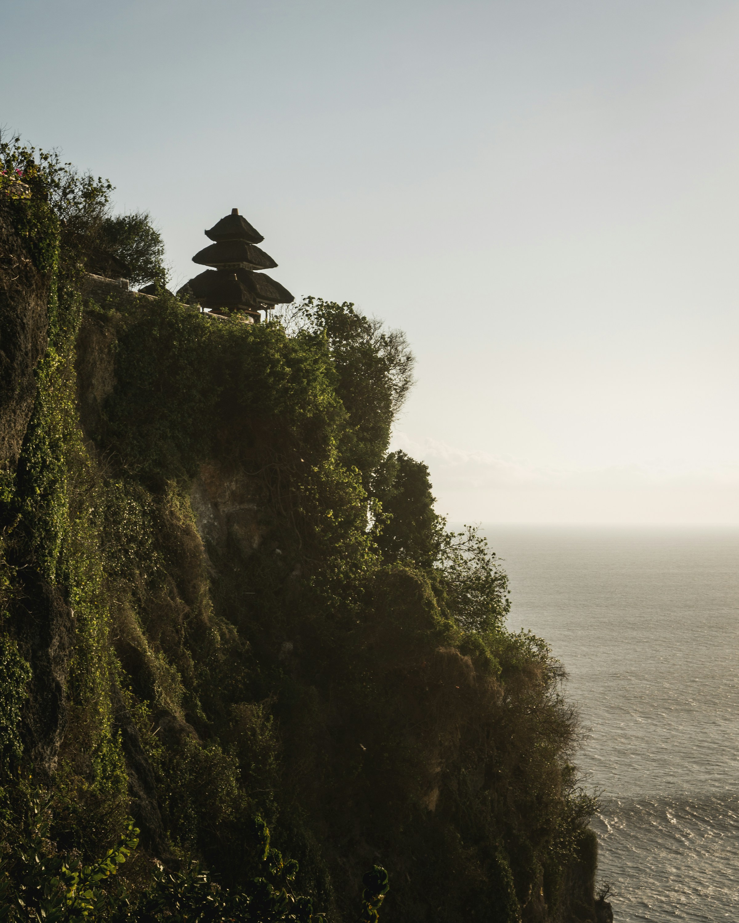 Uluwatu clifftop temple overlooking the ocean at golden hour